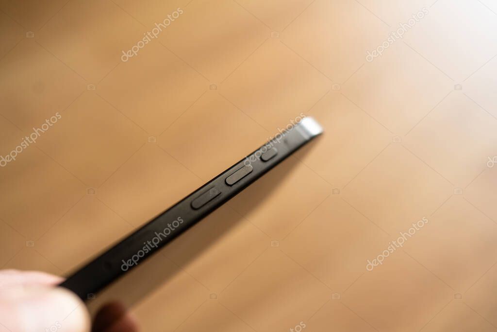 Kiev, Ukraine - February 26, 2025: Sidebar with keys iPhone 16 Pro close-up
