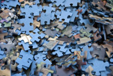 Jigsaw puzzle pieces. Blue puzzle parts.  Jigsaw puzzle background. Challenge and solution concept. Hobbies and leisure activities.