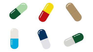 Beyaza izole edilmiş haplar. Renkli tıbbi kapsüller koleksiyonu.