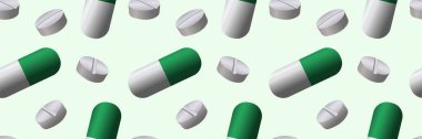 Tedavinin kusursuz bir düzeni var. Yeşil ve beyaz haplar ve kapsüller. Tıbbi arka plan yeşil ve beyaz renklerde.