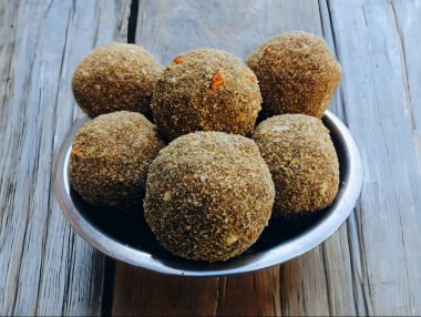 Gond ke laddu Also Called Karadantu, Antinaunde Gondh Ladoo Made Of Whole Wheat Flour, Tragacanth Edible Gum, Khus Khus, Badam, Gud, Ghee, Jaggery, Gur, Coconut, Dry Fruits. Preganant Woman Diet Food clipart