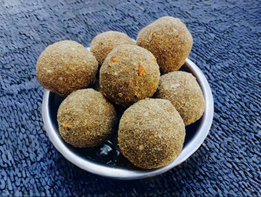 Gond ke laddu Also Called Karadantu, Antinaunde Gondh Ladoo Made Of Whole Wheat Flour, Tragacanth Edible Gum, Khus Khus, Badam, Gud, Ghee, Jaggery, Gur, Coconut, Dry Fruits. Preganant Woman Diet Food clipart