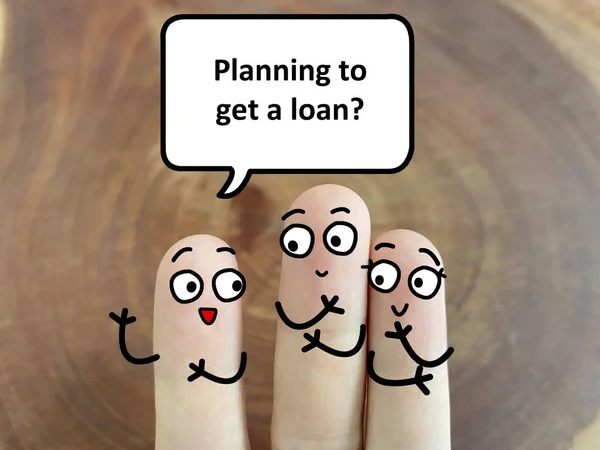Three fingers are decorated as three person discussing about business and economy. One of them is asking another two if they are getting a loan.