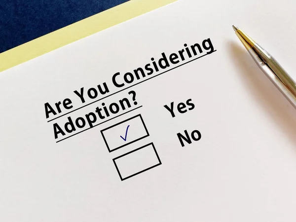 A person is answering question about infertility. He is considering adoption.