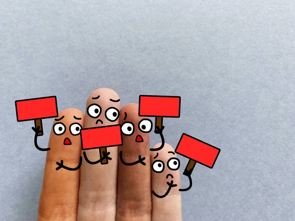Four fingers are decorated as four person. All of them are holding red boards.