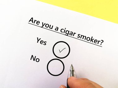 A person is answering question about substance use. He is a cigar smoker.