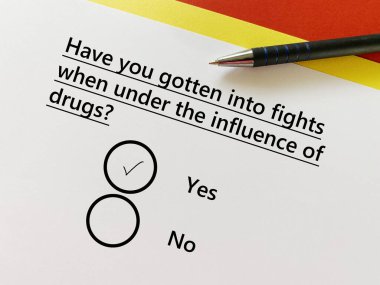 One person is answering question about substance use. He has gotten into fights when under the inlfuence of drugs.