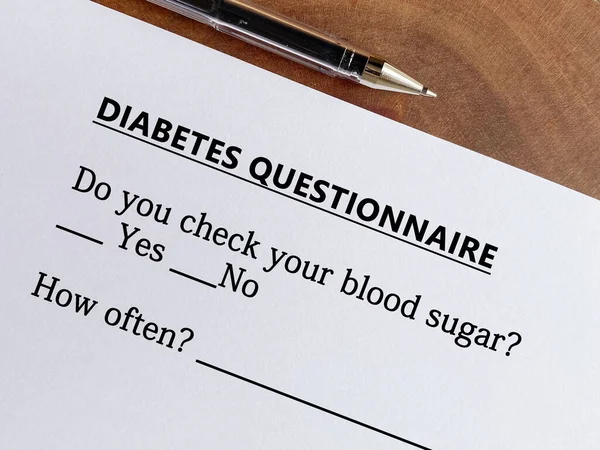 stock image A person is answering question about diabetes. He is thinking if he checks his blood sugar.