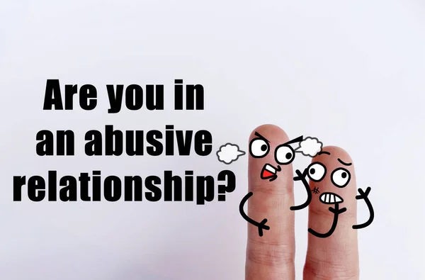 Two fingers are decorated as two person. They are in an abusive relationship.