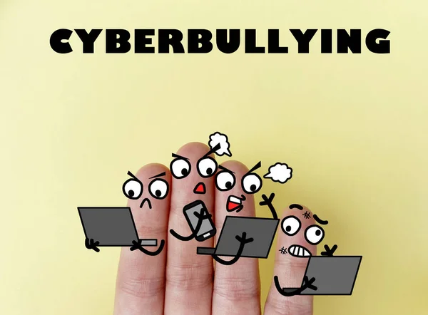 Four fingers are decorated as four person. This image is suitable to be used for anything about cyberbullying.