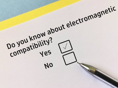One person is answering question about electronics. He knows about electromagnetic compatibility.