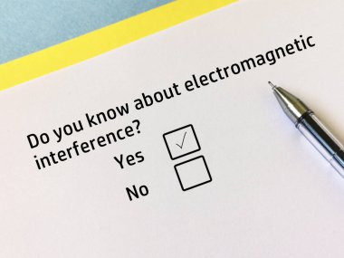 One person is answering question about electronics. He knows about electromagnetic interference.