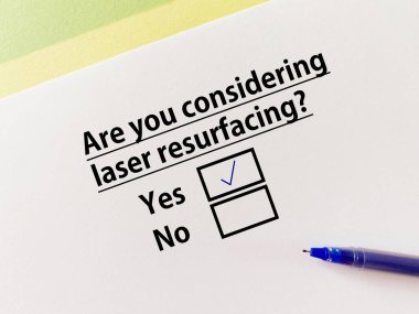 A person is answering question about cosmetic surgery. She is considering laser resurfacing.
