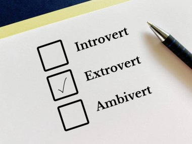 One person is answering question. He thinks he is extrovert.