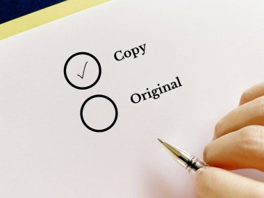 One person is answering question. He thinks he is choosing copy over original.