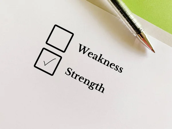 Stock image One person is answering question. He chooses strength over weakness.