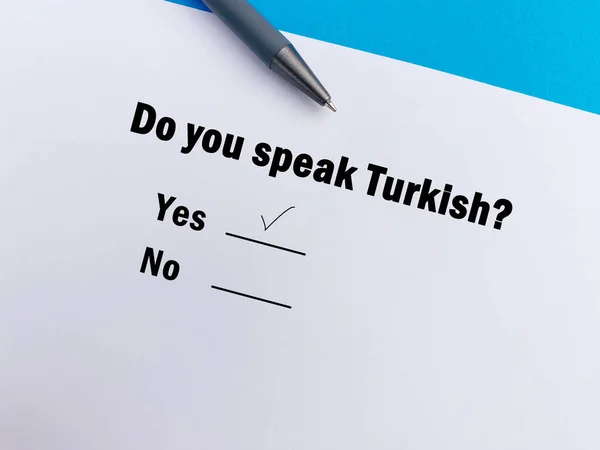 One person is answering question about languages. He speaks turkish.