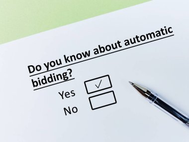 One person is answering question about agreement. He knows about automatic bidding.