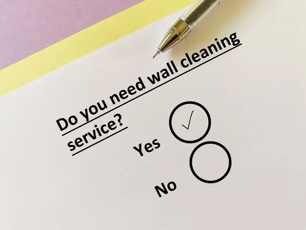 stock image One person is answering question about cleaning service. He needs wall cleaning service.