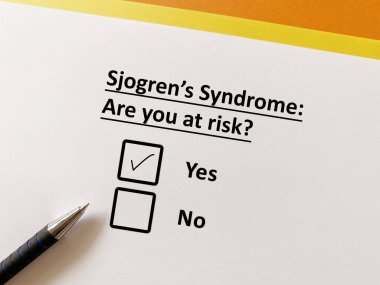 A person is answering question about orthopedic disease. He is at risk for Sjogren's syndrome. clipart