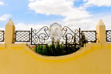 Faded Elegance of Meknes' Retro Tennis Court clipart