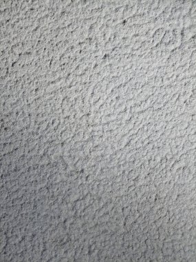  Beyaz macunu ve pürüzlü, pürüzlü dokusu olan bir duvar elementi. Sokak duvarı. Yüksek kalite fotoğraf