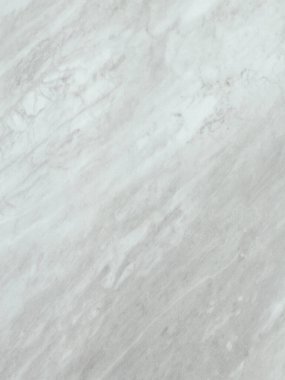 Light gray marble surface displaying natural veins and subtle textures, ideal for interior design, decoration, and material inspiration. Adds sophistication and elegance with a minimalist and timeless appearance. clipart