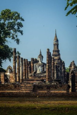 Ancient Buddah in Sukhothai Historical park. High quality photo clipart