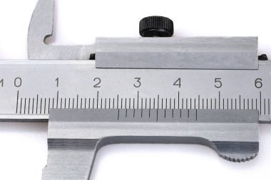 The scale of the caliper, on which the value of 1 inch is set equal to 2.54 centimeters. clipart