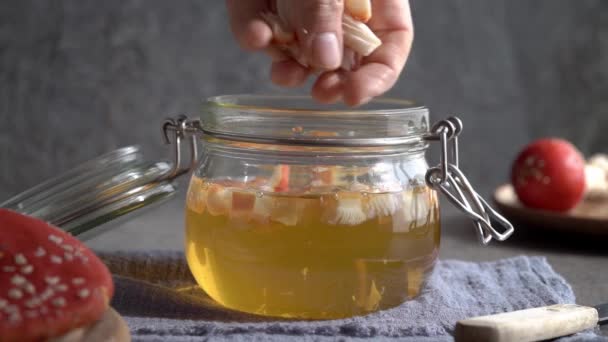 Pouring Chopped Fly Agaric Amanita Mushroom Jar Filled Alcohol Prepara — Vídeo de stock