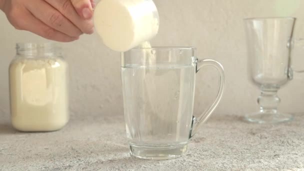 Putting Measuring Scoop Whey Protein Powder Glass Water Slow Motion — Stock video