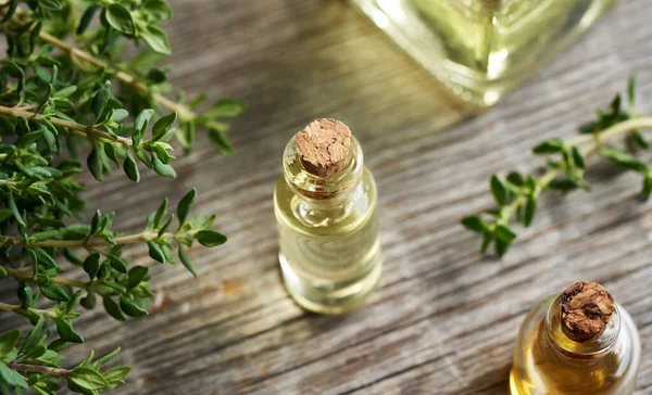 Thyme Essential Oil Glass Bottle Table — Stock Photo, Image