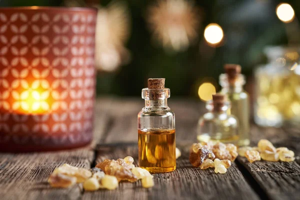 stock image Frankincense essential oil in a glass bottle with Christmas decoration