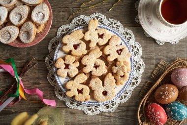 Linzer Easter cookies and colorful eggs decorated with wax clipart