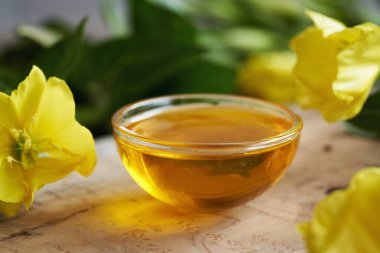 Evening primrose oil in a glass bowl - healthy nutritional supplement