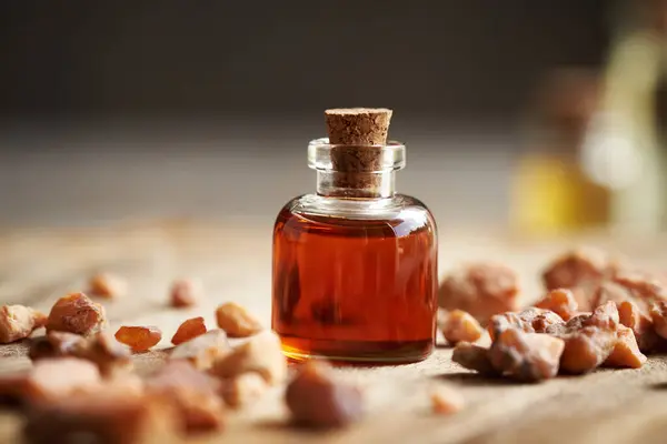 stock image A bottle of aromatherapy essential oil with styrax benzoin resin