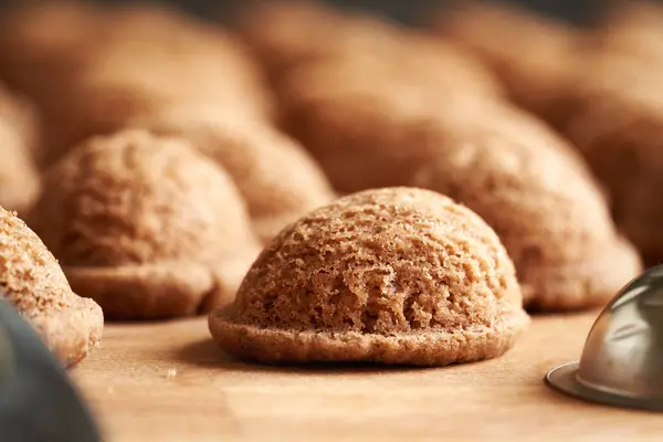 stock image Closeup of baked homemade Christmas cookies in the form of nuts, with tin molds