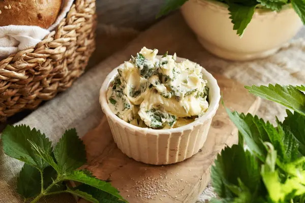 stock image Nettle butter in a bowl - homemade bread spread made of wild edible plants