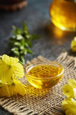 Evening primrose oil in a glass bowl - healthy nutritional supplement