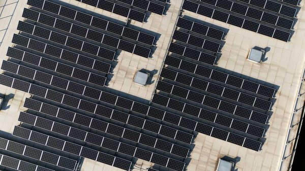 Detailed aerial view of a solar panel array on a rooftop in Epernay, France, showcasing clean energy technology and sustainable design.