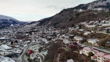 Aerial view of Sogndal valley with snowy rooftops and mountains on November 22 2024 