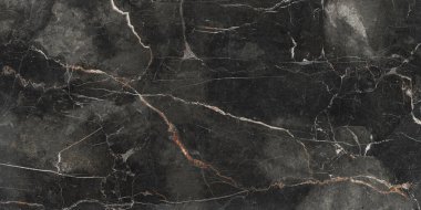 Black marble texture pattern, dark background with a multicolored vein, metallic surface with a sandy structure, close-up of rusty and shiny ceramic high-gloss design. 