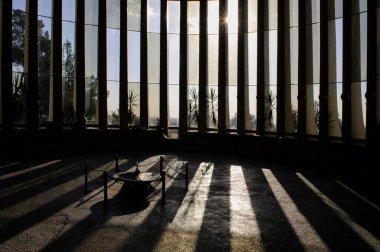 Eternal flame and columns seen in an interior view of the Yad Kennedy memorial to President John F. Kennedy in Jerusalem, Israel.  clipart