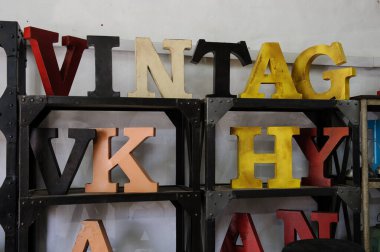 Vintage, antique, large, painted wood-block letters in various colors.  clipart