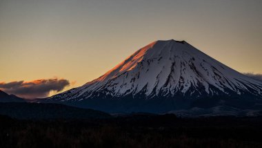 Orodruin, Mount Doom, Ngauruhoe snow cap at sunset, Tongariro National park, New Zealand clipart