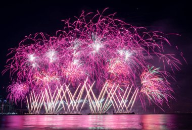 Bright beautiful colorful fireworks celebration in the night sky. Photo taken in Busan, South Korea during the Busan Fireworks Festival 2024 clipart