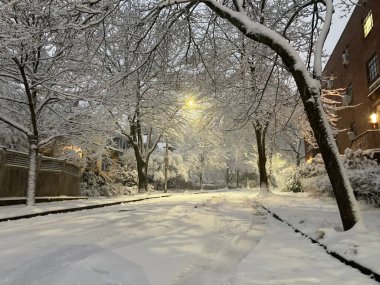 Snow street during the winter in Brookline MA clipart