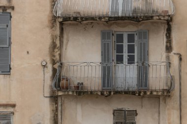 Door and Balcony details on the facade of old Buildings in Bonifacio