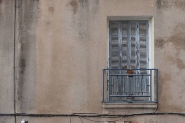 Door and Balcony details on the facade of old Buildings in Bonifacio