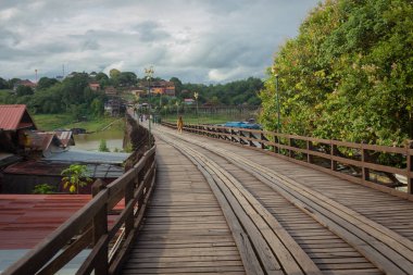 WoodenMon Bridge isThailand's longestwooden bridgewith the length of 850 meters.  It was builded for comfortable transportation between people living in Sangkhlaburi andMonVillages. clipart